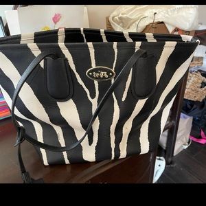 Large hard leather coach print bag gently used almost like new